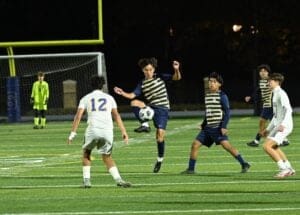 Salesianum soccer Alexander Wang intercepts a pass against Caesar Rodney. Photo by Nick Halliday