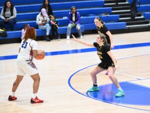 Padua basketball Lilly DiMarco led Padua in scoring but also had to Defend Sara Benson from Dover. Photo by Nick Halliday