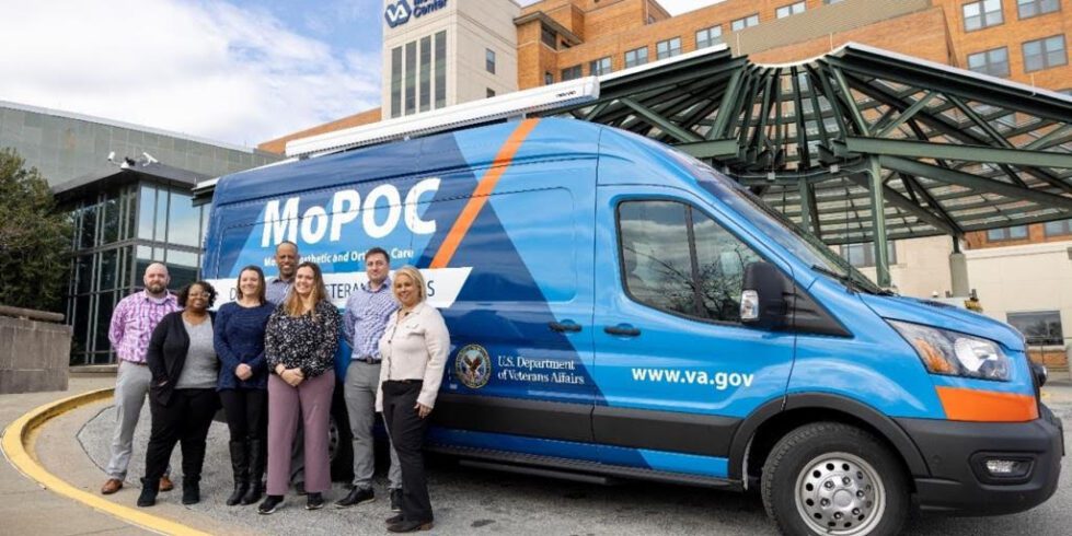 Wilmington VA: mobile clinic to expand access to prosthetics and orthotics for rural vets 5 From left to right is Prosthetics Chief Corey Smith, Advanced Medical Support Assistant Rosemarie Hawkins, Prosthetic Representative Tina Parsons, Prosthetic Assistant Chief Warren Lingham, Certified Prosthetist and Orthotist Cassandra Thatcher, Certified Pedorthist Devin Burgin, and Inventory Manager Mayra Hurtado standing next to the Mobile Prosthetic and Orthotic Mobile Clinic in front of the Wilmington VA Medical Center.