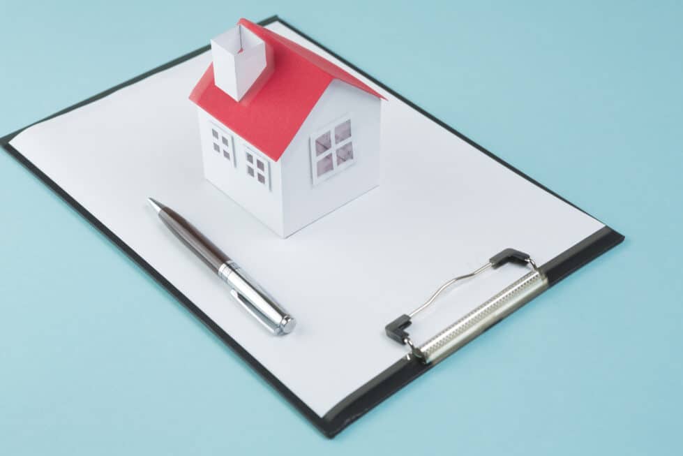 Wilmington extends property tax deadline to Sept. 30 12 small house model pen blank clipboard blue backdrop