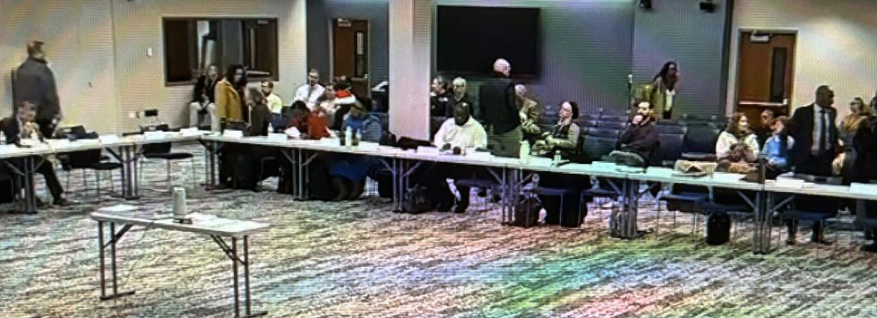 Redding Consortium Recommends Single Northern New Castle County School District 2 Redding Consortium members meeting around a U-shaped table.